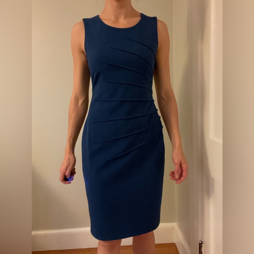 Calvin Klein blue dress with sunburst detailing in front